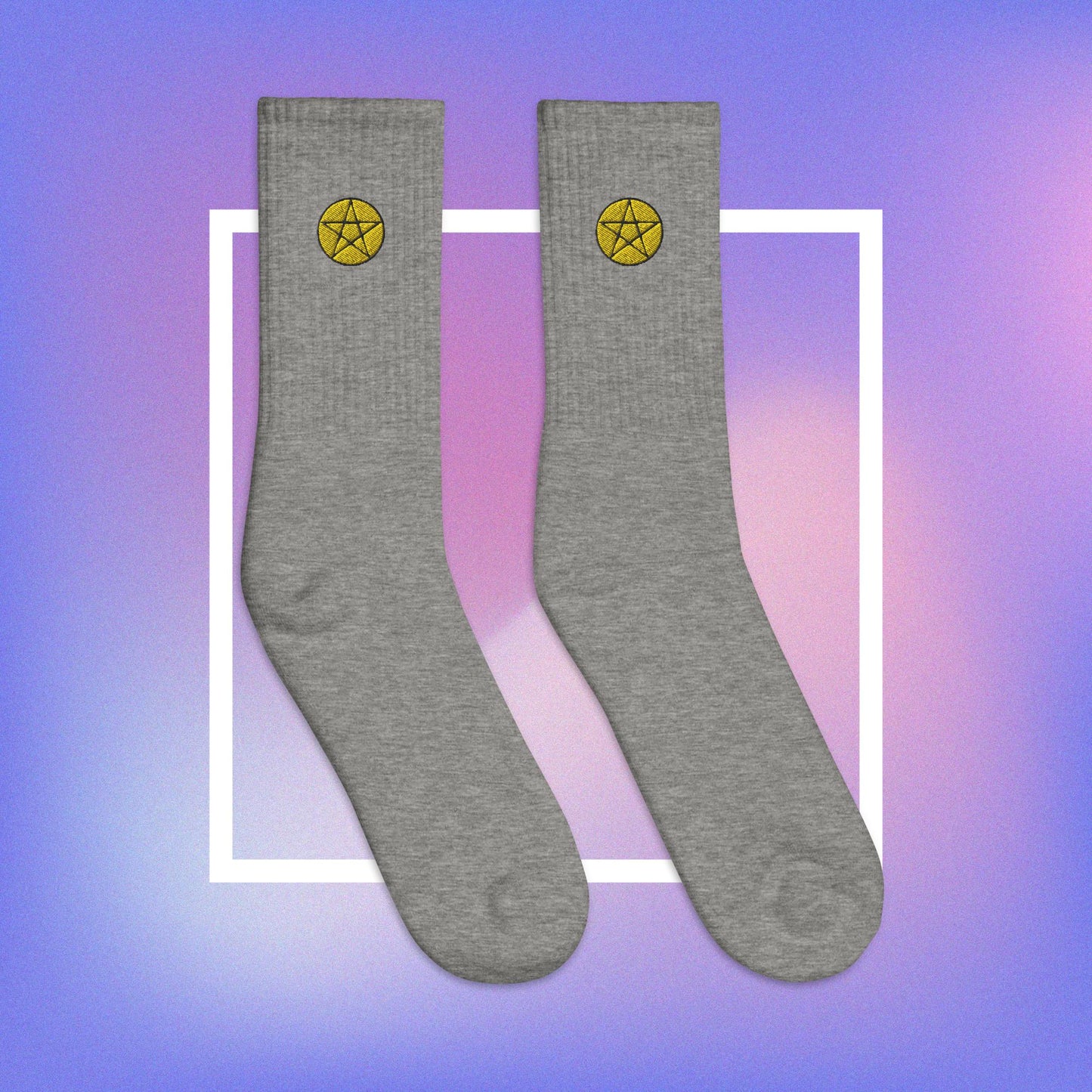 Vibrant yellow pentacle design on comfortable, high-quality grey socks.